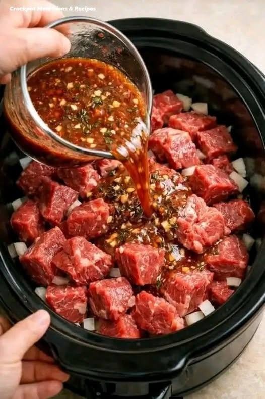 Put raw cubed beef in a slow cooker with these 3 ingredients. You won’t believe how good it tastes..